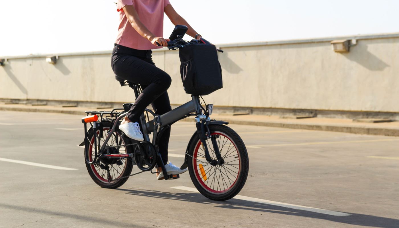 A young woman riding an electric bike