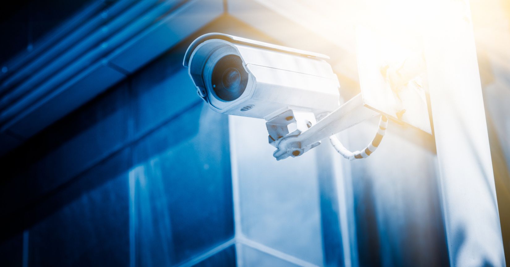 Security camera with office building background.