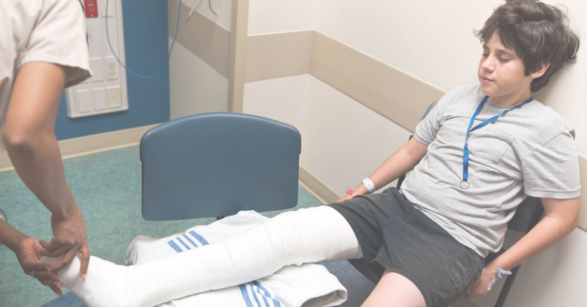 Child in a hospital with a broken leg