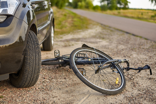 Photo of car and bicycle on the road, the concept of road accidents.