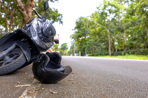 Motorcycle accident with helmet on road and safety reminder Save Life message, concept of road safety and awareness