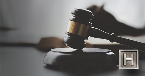 Image of a Judge's gavel. The Hilliard Law logo is in the lower left corner.
