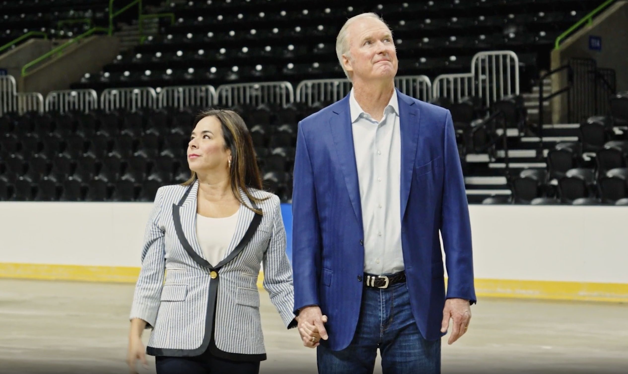 Bob and Catherine Hilliard standing together inside the Hilliard Center arena